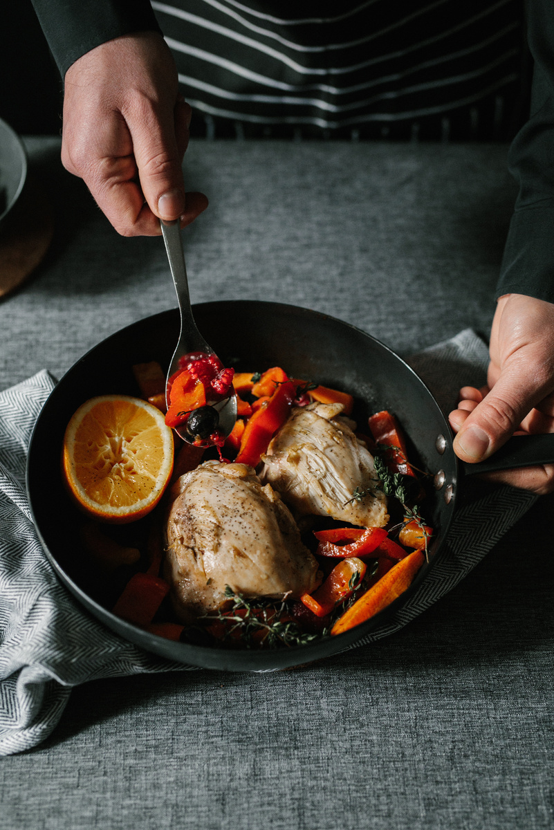 Moody Restaurant Dining and Chef Plating Chicken Dish